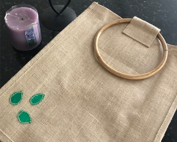 Jute bag beside a candle image