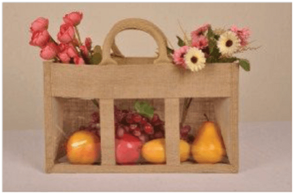 Jute bag holding fruits and flowers image